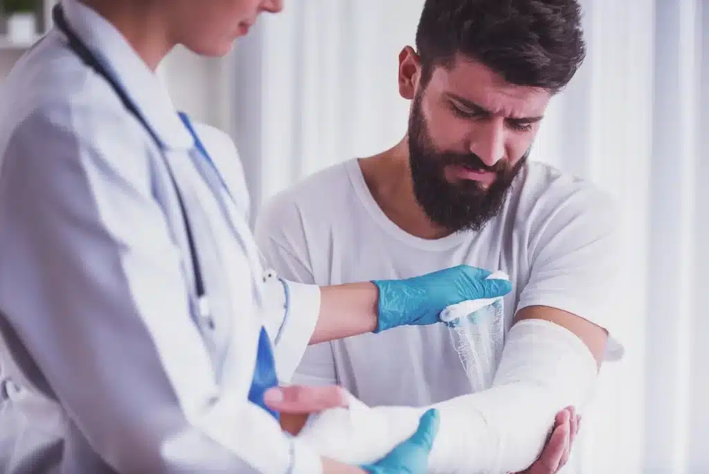 A man with a broken arm in a cast.