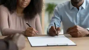 Filling out paperwork with an attorney.