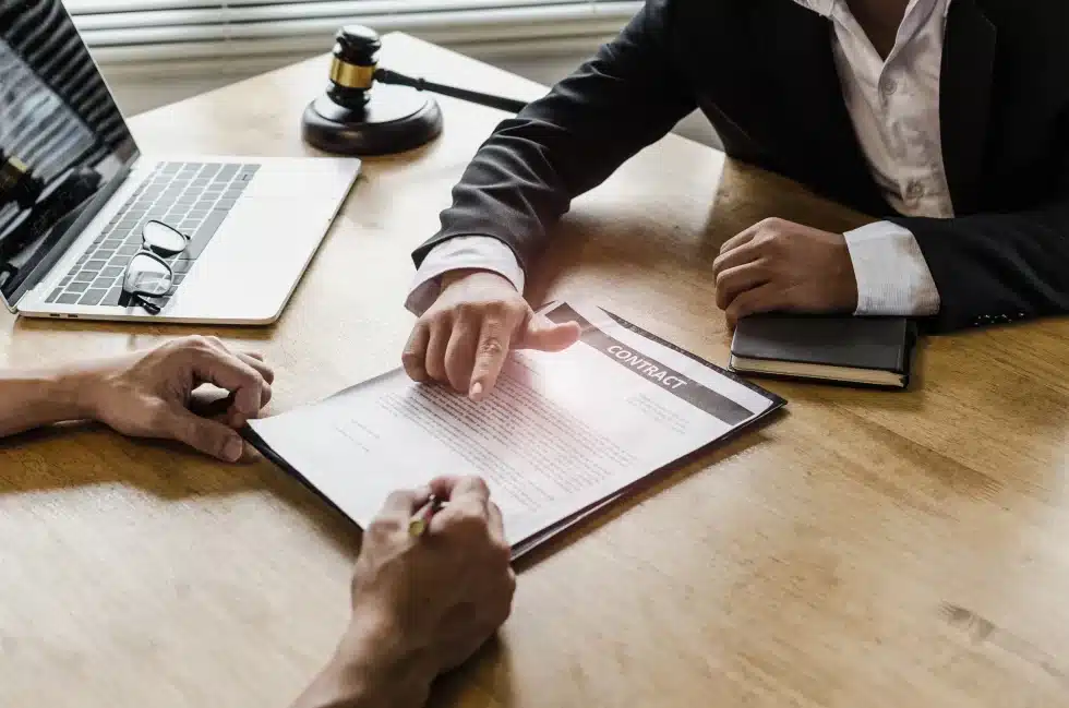 lawyer and client signing contract